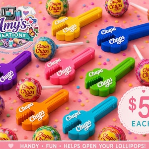 May include: A collection of colourful plastic Chupa Chups lollipop openers in yellow, blue, purple, pink, green, orange, and teal, each featuring the Chupa Chups logo. The openers are arranged among various Chupa Chups lollipops and colourful sprinkles.