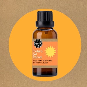 May include: A brown glass bottle with a black cap and a yellow label. The label has a sun graphic and the text "Dobro je! mood" in black. The text "ULJNI BLEND ZA DIFUZERE DIFFUSER OIL BLEND" is also on the label.