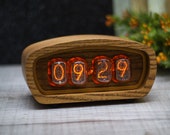 IN12 nixie tube clock. Old radio style 4 tubes. Mid century style. Natural wood case with eco linseed oil. Amber backlight.