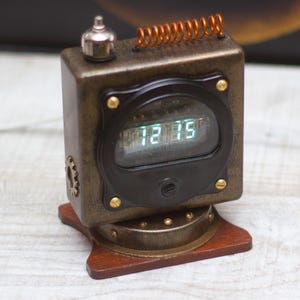 VFD Ice clock on IVL2-7/5 vacuum fluorescent display. Steampunk design. USB supply.