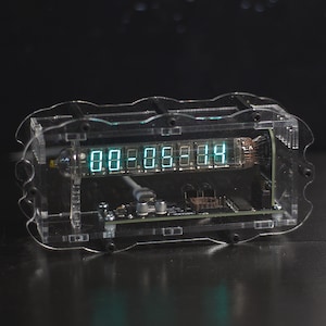 VFD Ice clock on IV-18 vacuum fluorescent tube. Original acrylic case design. USB supply.