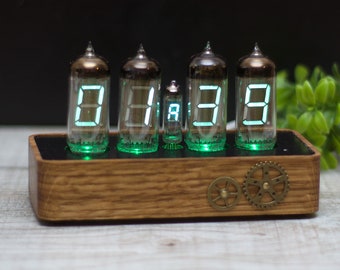 VFD Ice clock. IV-11 vacuum lamps and adjustable green backlight. Wooden oak tree case and USB supply.