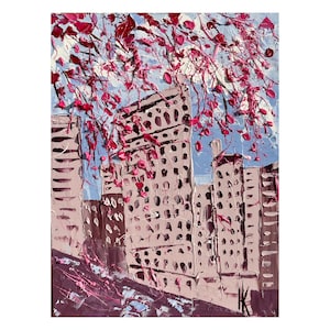 May include: An abstract cityscape painting with textured brushstrokes. Buildings in shades of beige and brown are topped with pink blossoms against a blue sky. The artwork has a modern, impressionistic style, with visible paint texture.