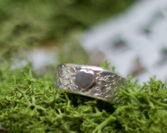 Silver ring with structure and heart "Only love counts"