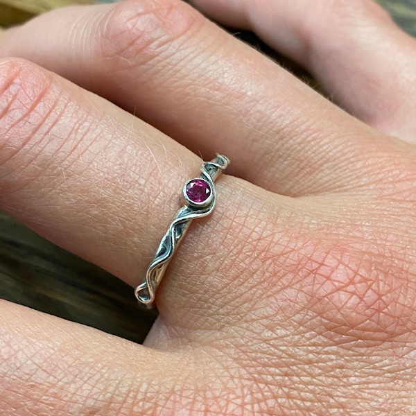 Silver ring with ruby in size 54