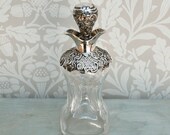 An antique sterling silver topped glass scent or perfume bottle, Victorian hallmarked Birmingham 1896