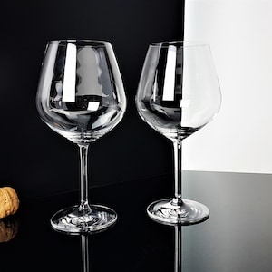 Two large vintage crystal wine glasses