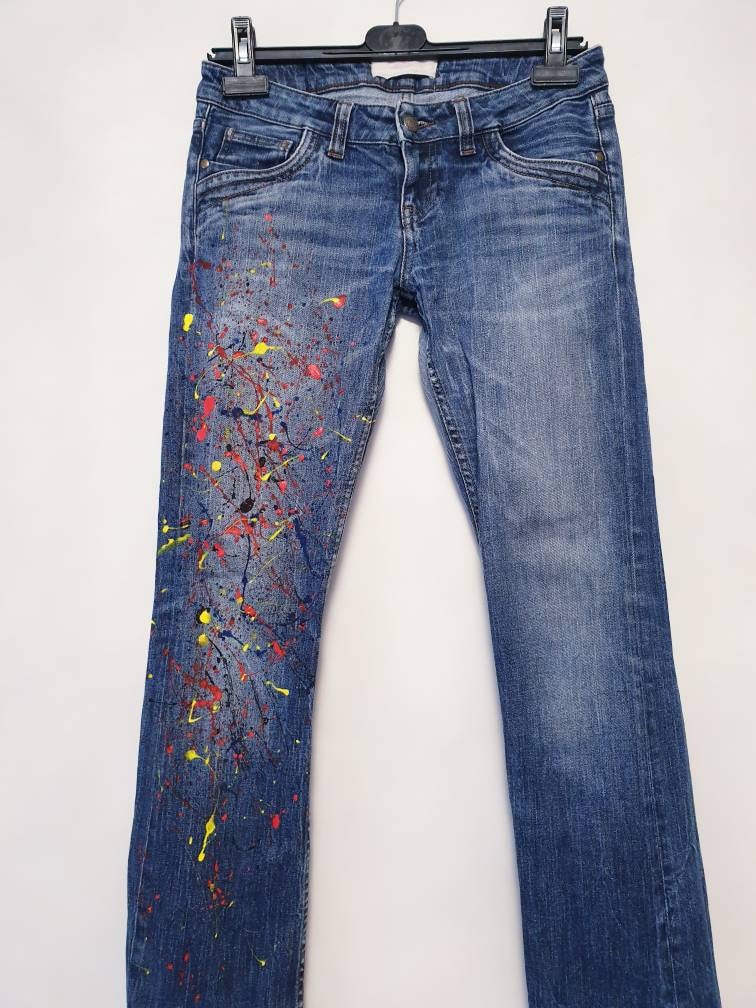 womens jeans with paint splatter