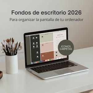 May include: A laptop displaying a desktop background with a calendar and file icons. The screen shows a color-blocked design in shades of green, brown, and beige. Text on the screen reads "Fondos de escritorio 2026" and "ICONOS CARPETAS". A white ceramic container holds paintbrushes.