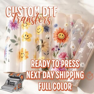 May include: Custom DTF transfers with a floral and smiley face design. Ready to press, next day shipping, full color.