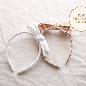 May include: Two headbands with fabric bows. One headband is white with a white bow and the other is brown with a brown and white gingham bow. The text "PDF Headband Pattern" is in a circle in the upper right corner of the image.
