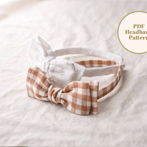 May include: Two fabric headbands with bows. One headband has a white bow with a textured pattern. The other headband has a brown and white gingham bow. The text "PDF Headband Pattern" is on a white circle with a brown outline.