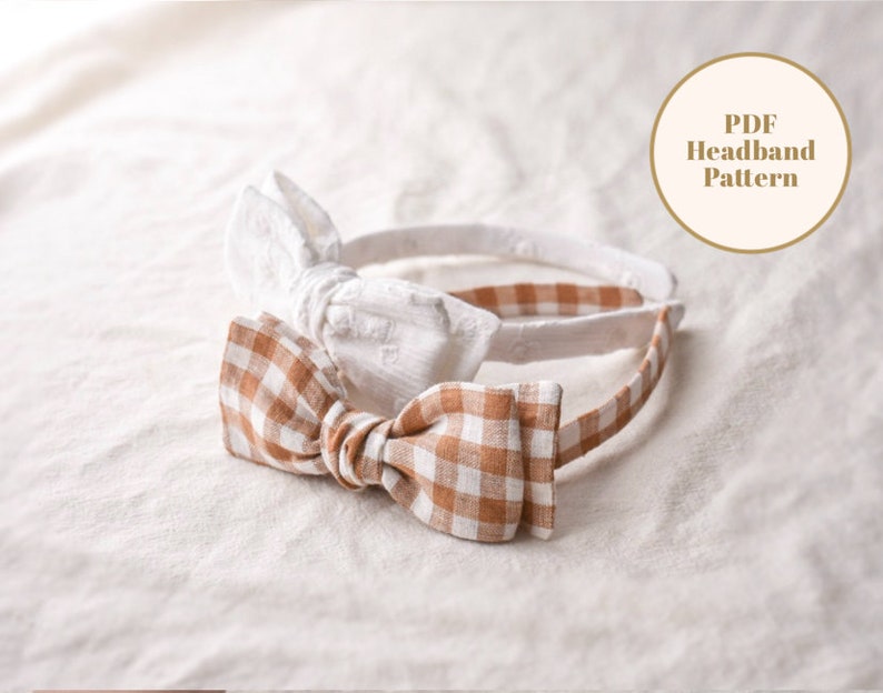 May include: Two fabric headbands with bows. One headband has a white bow with a textured pattern. The other headband has a brown and white gingham bow. The text "PDF Headband Pattern" is on a white circle with a brown outline.