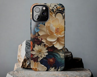 May include: A smartphone case featuring a floral design with large, cream-colored flowers, blue accents, and a dark background. The case has a glossy finish and is displayed on a textured stone surface.