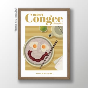 May include: A framed print depicting a smiling congee dish with fried eggs and bacon, chopsticks, and a teapot. The text reads "Mushu's Congee, A Chinese Special" and "Happy to see you - Est. 1999". The print is in a light wood frame.