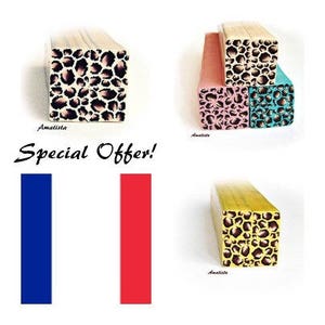 May include: Three wooden blocks with a leopard print design. The blocks are in different colors: pink, blue, and yellow. The blocks are stacked on top of each other. The text "Special Offer!" is written in black letters on a white background.