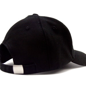 May include: A black baseball cap with a curved brim and a silver buckle closure.