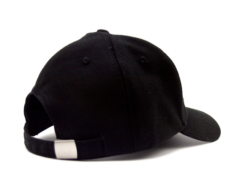 May include: A black baseball cap with a curved brim and a silver buckle closure.