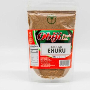 May include: A clear plastic bag filled with ground ehuru spice. The bag has a red and green label with the text "Obiji Foods Ltd." and "GROUND EHURU".