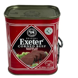 May include: A red rectangular can of Exeter Corned Beef with a silver lid. The label features the brand name, product description, and a diamond-shaped graphic. The can weighs 12 oz.