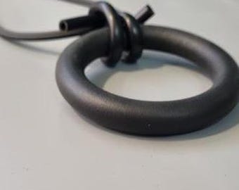 black circle pendant necklace, black rubber necklace, black contemporary pendant, black avant garde jewelry, black exaggerated necklace