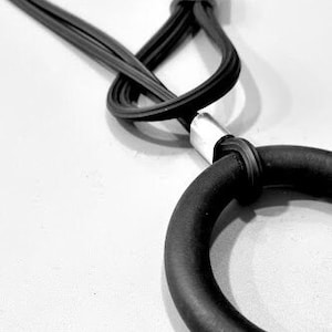 black & silver necklace, black circle rubber pendant necklace, black contemporary necklace, black asymmetric necklace, avant garde jewelry