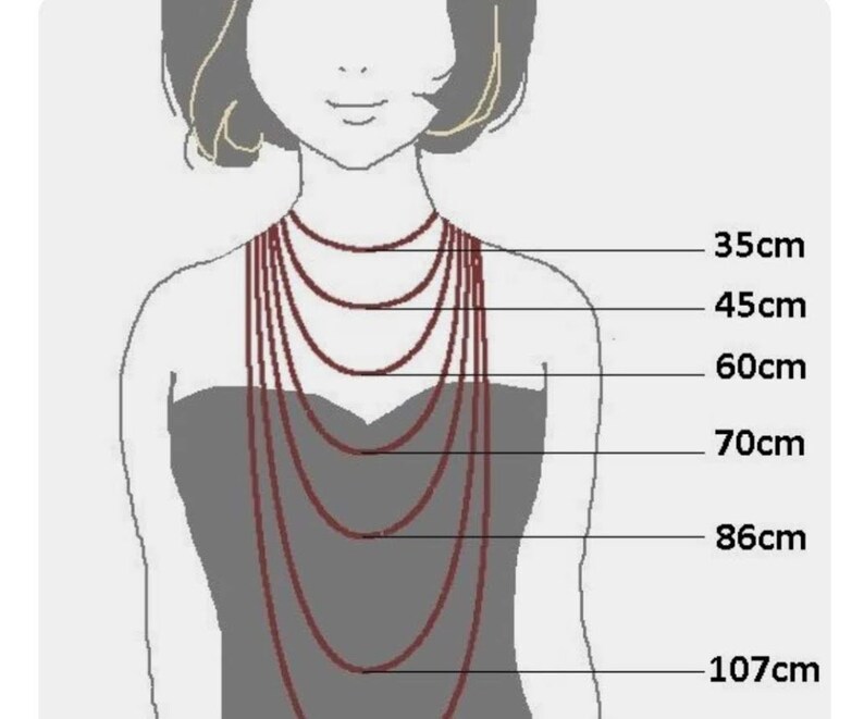 May include: Diagram showing different necklace lengths on a person, with measurements in inches: 14 inches, 18 inches, 24 inches, 28 inches, 34 inches, and 42 inches.