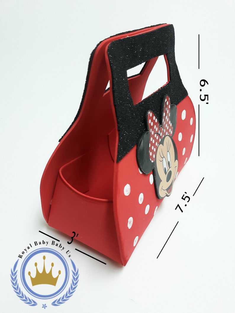 May include: Red Minnie Mouse-themed gift bag with white polka dots and a black glitter handle. The bag is 7.5 inches long, 6.5 inches high, and 3 inches wide. Features a Minnie Mouse face and bow.