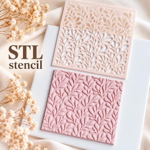 May include: A square light pink stencil with a cutout leaf pattern and a square dusty rose textured tile featuring a raised leaf pattern. The text STL stencil is printed in dark brown on the left side of the image.