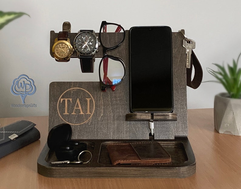 Your grandpa always misplaces his stuff? So, why not give him a little helping hand with this Personalized Docking Station. A practical gift to keep all his essentials together in one place. This docking station has a port for him to insert a phone cable and charge it. What a convenient item!