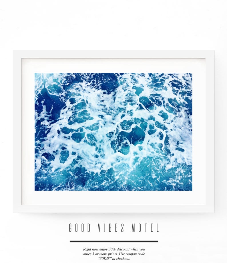 May include: A framed photograph of a close-up of blue ocean water with white foam. The text "GOOD VIBES MOTEL" is below the image. The text "Right now enjoy 30% discount when you order 3 or more prints. Use coupon code "30DIS" at checkout." is below the text.