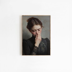 May include: A painting of a woman in a black dress with lace detailing. She is looking down and covering her face with her hand. The background is a muted gray.