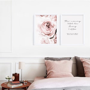 May include: Two framed prints with white frames. The print on the left features a close-up of a pink rose. The print on the right features a quote that reads "These mornings with her having coffee every cup makes me grateful for having her in my life."