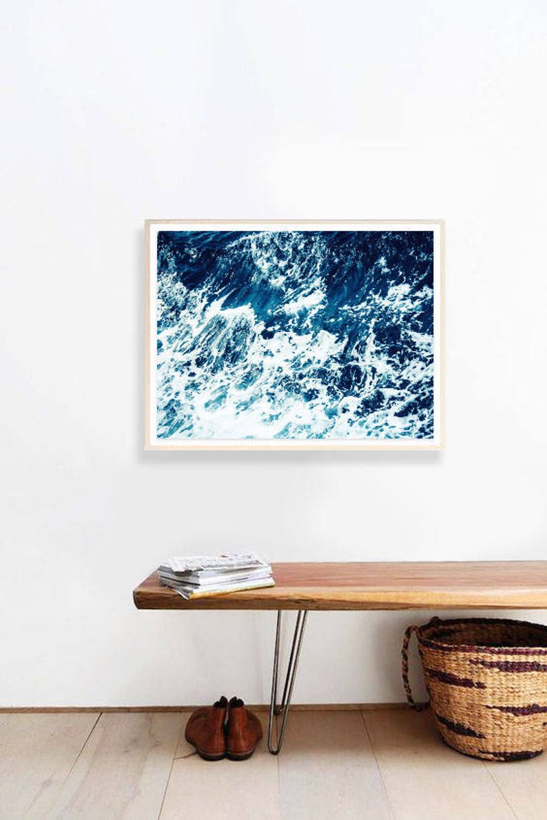 May include: A framed photograph of a close-up of ocean waves with white foam and deep blue water.