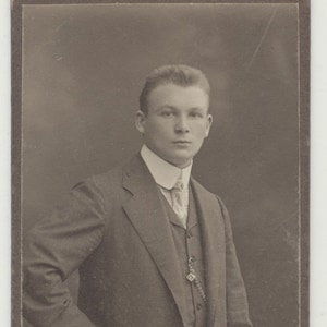 Young German Man Standing w/ Chair. Silver Print on Board. Berlin.