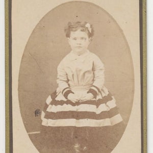 CDV Photo From The 1800s of Curly Haired Girl With Bow and Striped Skirt//Pennsylvania CDV Portrait//Big Eyed Little Girl