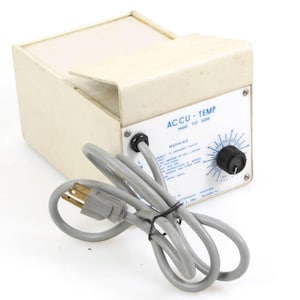 May include: A white Accu-Temp model TC 500 temperature control unit with a black knob and a power cord. The unit has a warning label with instructions for use.