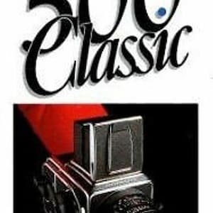May include: A Hasselblad 500 Classic camera is featured in this image. The camera is silver and black, with a prominent lens. The text "Hasselblad" and "500 Classic" are displayed in white on a white background.