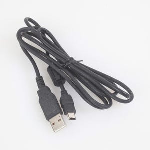 May include: A black USB charging cable with a USB-A connector and a micro-USB connector. The cable is coiled and secured with a black tie. The connectors are black with silver-colored metal contacts.