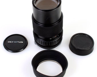 Objetivo telefoto Olympus de zoom automático de 75-150 mm para cámara de película, con tapas y parasol.