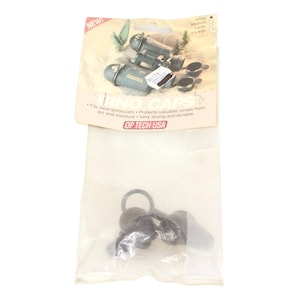 May include: OP/TECH USA binocular caps in a clear plastic bag. The packaging includes a picture of binoculars and the text "BINOC CAPS". The caps are designed to protect binoculars from dirt and moisture.