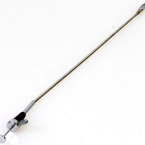 May include: A long, thin, silver medical instrument with a black handle and a small, round tip.