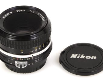 Obiektyw stałoogniskowy Nikon 50 mm 2.0 AIS z dekielkami