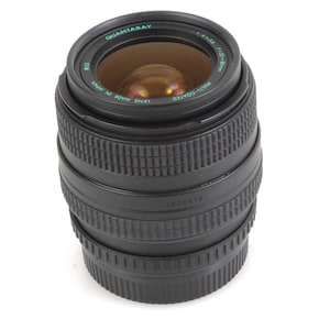 May include: A black camera lens with a silver ring around the front. The lens has the text "Quantaray" and "Multi-Coated Lens Made in Japan" printed on it.