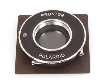 Tominon 127mm F4.7 Lens in Polaroid Copal Shutter W/ 3 5/8 Board