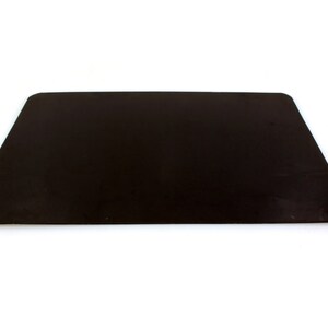 May include: A black rectangular baking sheet, ideal for use in the kitchen.
