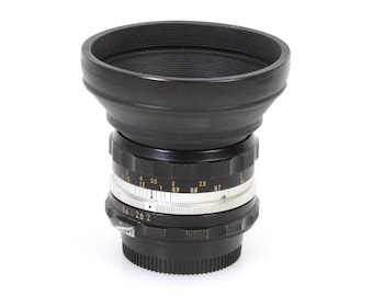 Obiektyw Nikon 50 mm 2.0 Nikkor H.C z osłoną przeciwsłoneczną