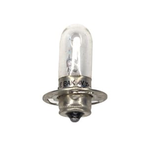 Puede incluir: Una bombilla de luz de vidrio transparente con una base de metal plateado y una etiqueta negra que dice "BAK 4V X".
