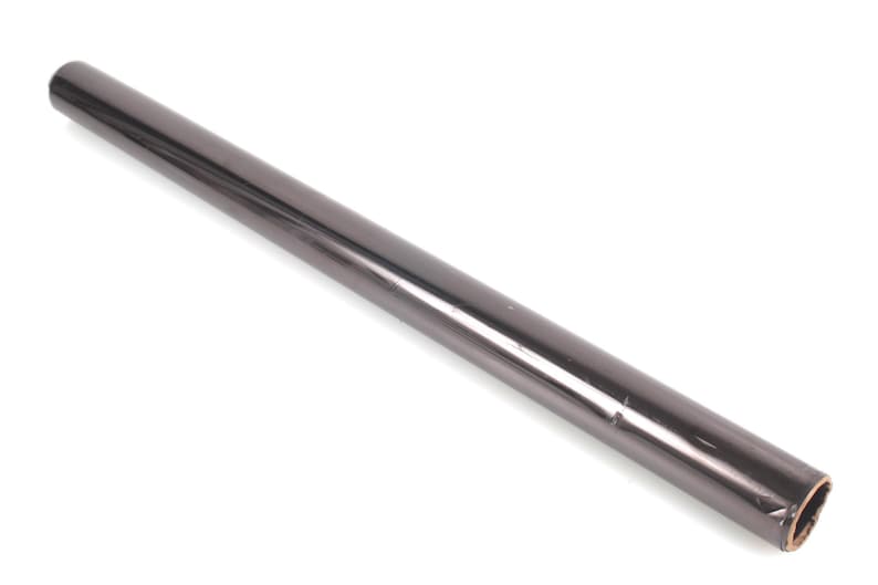 May include: A roll of dark gray wrapping paper. The paper is rolled tightly and appears to be made of a glossy material. The roll is cylindrical and lies on a white surface.