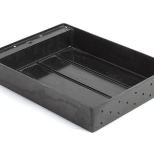 May include: Black plastic tray with a rectangular shape and a textured bottom. The tray has a raised edge and a series of small holes along the sides.